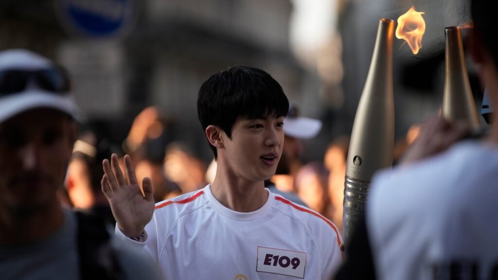 BTS' Jin carries Olympic torch ahead of 2024 Paris Olympics. See pics FilmyMeet